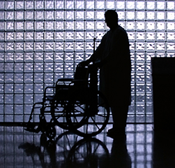 Person next to wheel chair